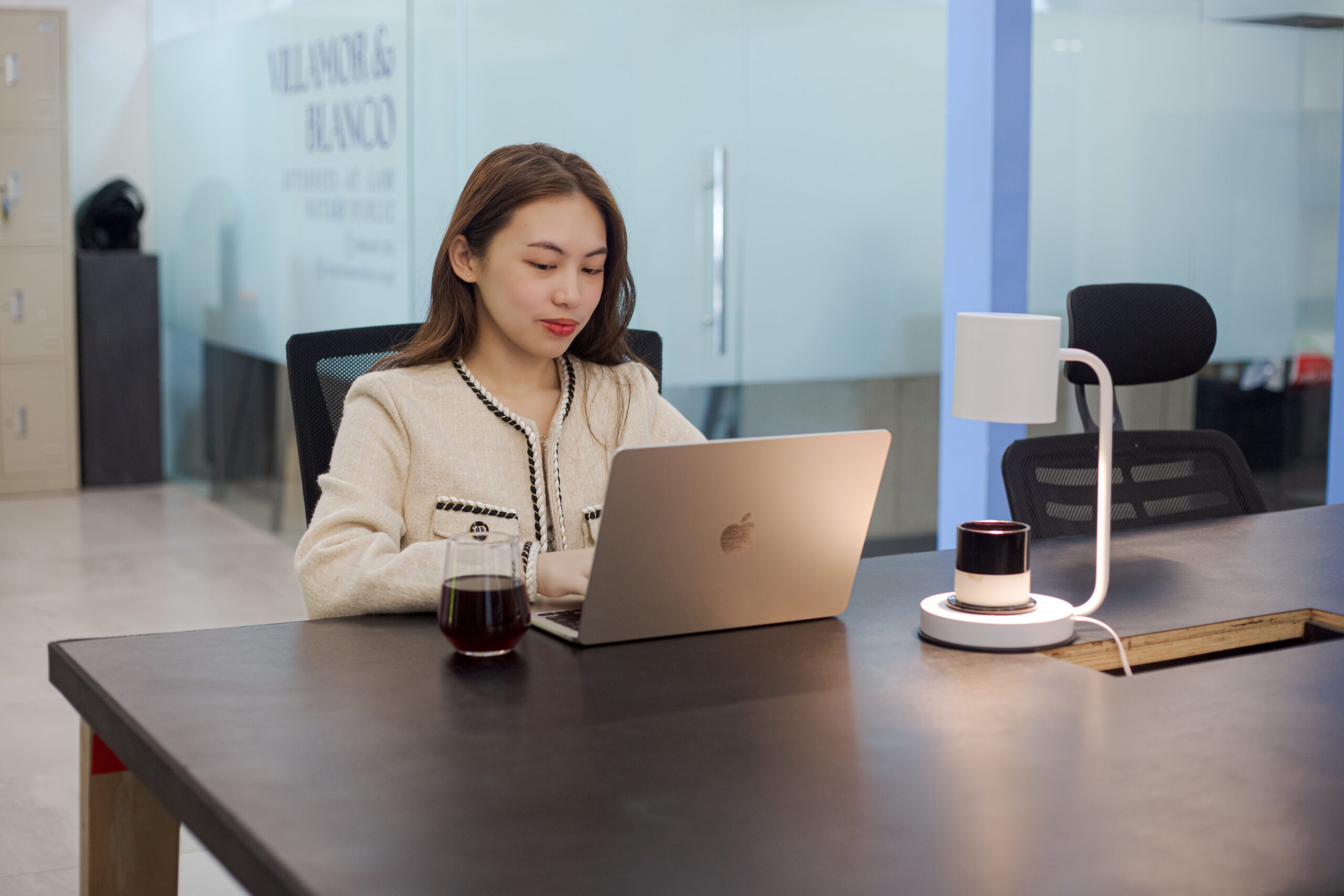 Woman working on a laptop inside a dedicated space at From Here Cebu.